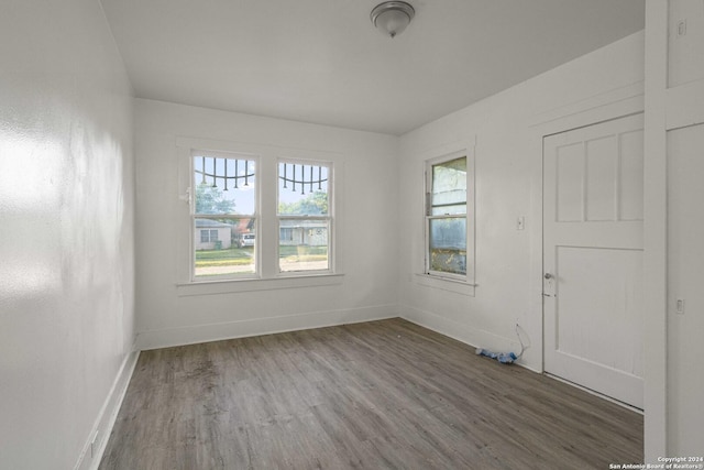 spare room featuring dark wood-type flooring