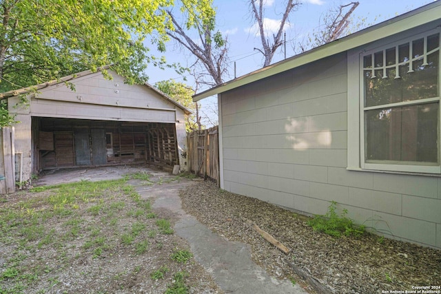 view of side of property with an outbuilding