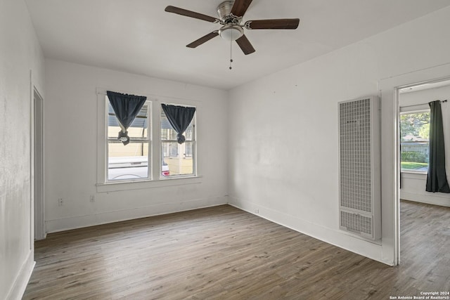 empty room with ceiling fan and wood-type flooring