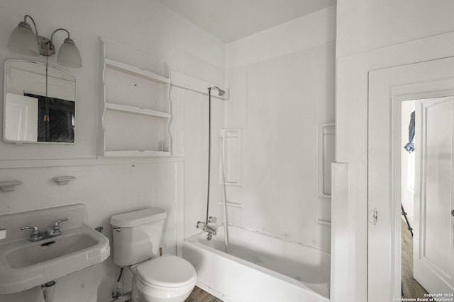 full bathroom featuring sink, toilet, and washtub / shower combination