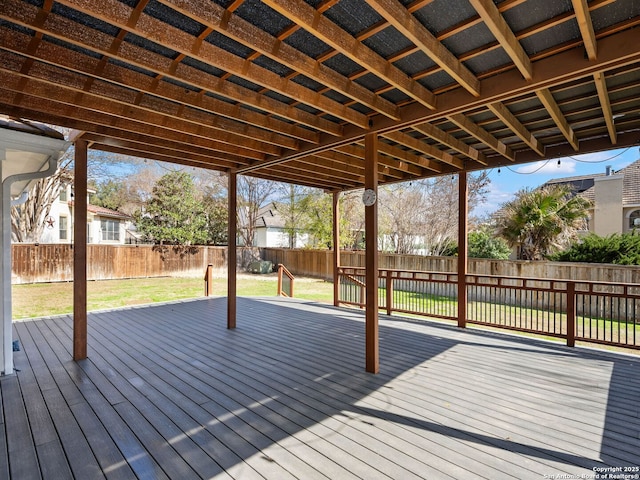 wooden deck with a lawn