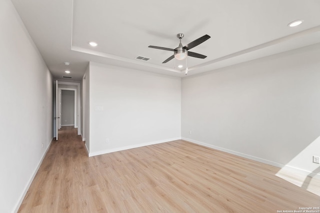 125 Connor Crk, San Antonio, TX 78253 - empty room featuring a tray ceiling, recessed lighting, ceiling fan, light wood finished floors, and baseboards