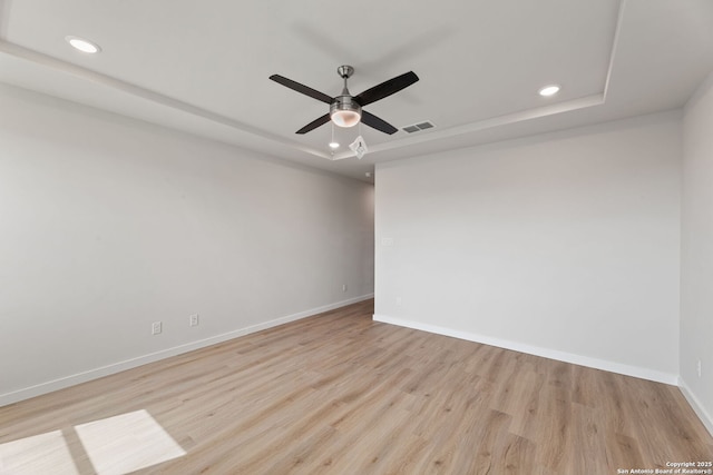 125 Connor Crk, San Antonio, TX 78253 - empty room featuring a raised ceiling, recessed lighting, baseboards, wood finished floors, and ceiling fan