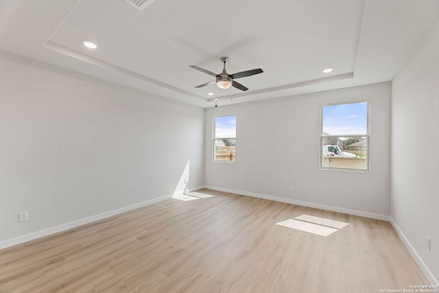 125 Connor Crk, San Antonio, TX 78253 - unfurnished room featuring a raised ceiling, recessed lighting, light wood-type flooring, baseboards, and ceiling fan