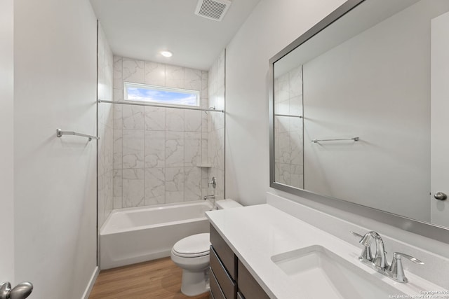 125 Connor Crk, San Antonio, TX 78253 - bathroom with toilet, vanity, wood finished floors, and washtub / shower combination