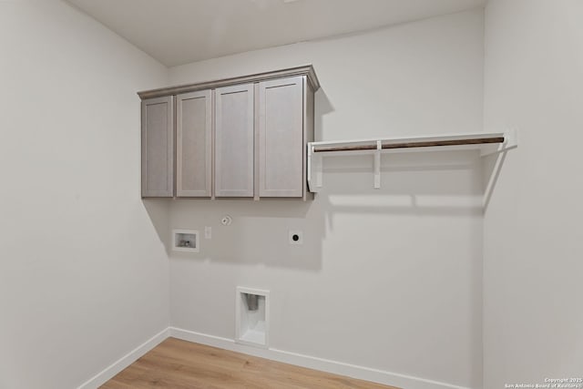 125 Connor Crk, San Antonio, TX 78253 - laundry area with hookup for an electric dryer, hookup for a washing machine, gas dryer hookup, baseboards, and light wood-style floors