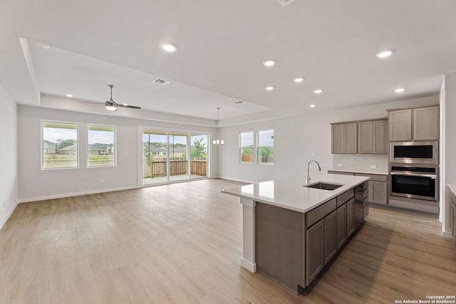 125 Connor Crk, San Antonio, TX 78253 - kitchen with stainless steel appliances, a sink, healthy amount of natural light, light countertops, and recessed lighting