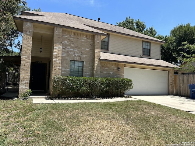 view of front facade with a garage and a front yard