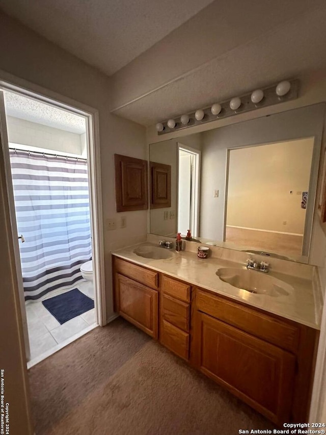 bathroom featuring vanity, a shower with curtain, and toilet