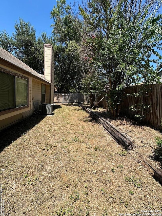 view of yard with central AC