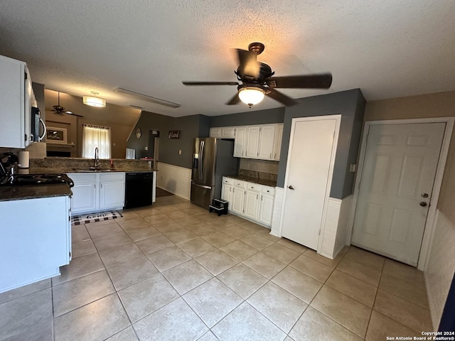 kitchen featuring appliances with stainless steel finishes, white cabinets, ceiling fan, sink, and kitchen peninsula