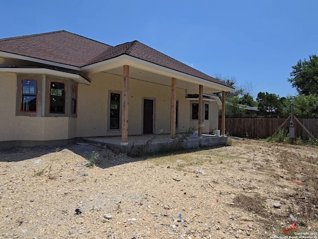 rear view of property featuring a patio area