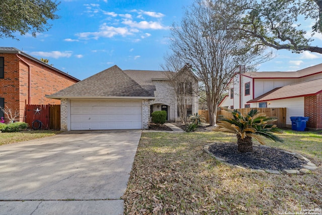 view of front of property featuring a front yard and a garage