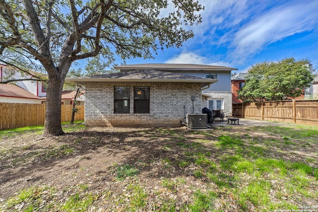 back of property featuring central air condition unit and a patio area