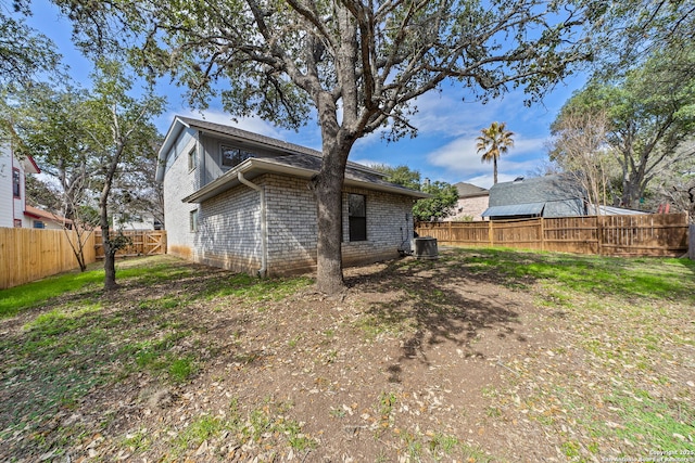 rear view of house with central air condition unit