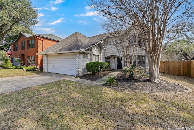 view of front of property with a front yard and a garage