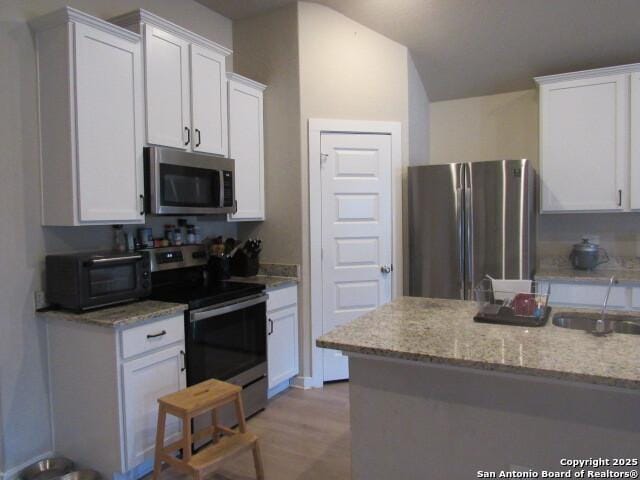 kitchen featuring white cabinets and stainless steel appliances