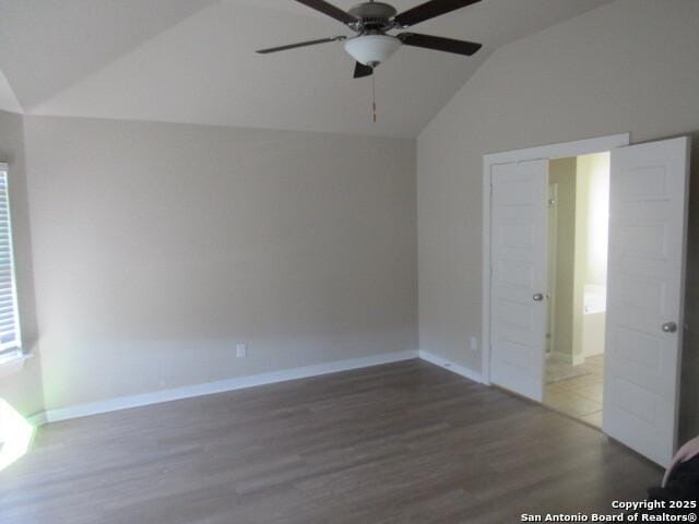 unfurnished bedroom featuring vaulted ceiling, ceiling fan, and dark hardwood / wood-style floors