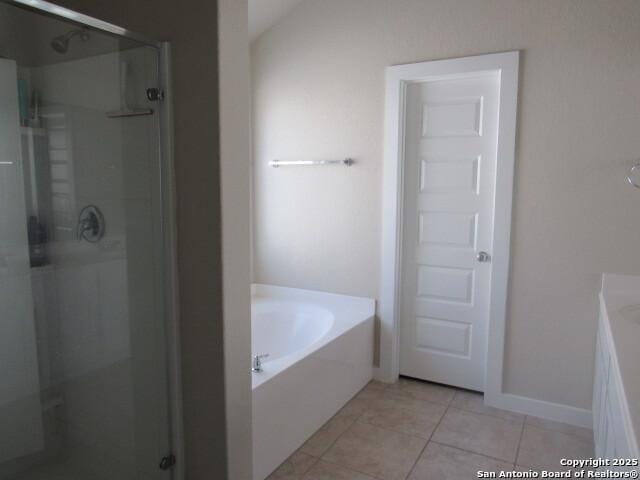 bathroom featuring shower with separate bathtub and tile patterned floors