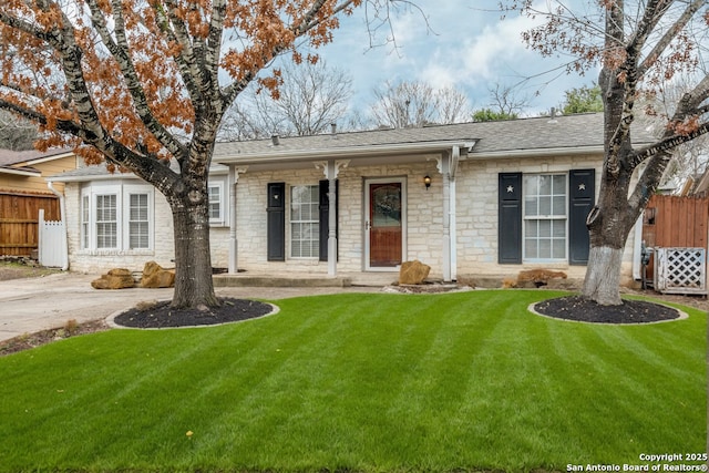 ranch-style home with a front yard