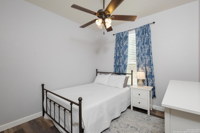 bedroom featuring hardwood / wood-style flooring and ceiling fan