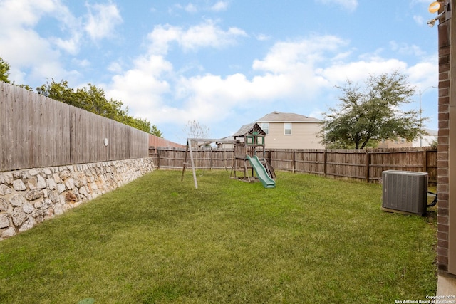 view of yard with a playground and cooling unit