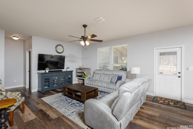 living room with ceiling fan and dark hardwood / wood-style floors