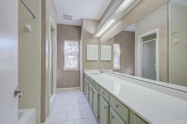 full bath featuring tile patterned floors, walk in shower, vanity, and baseboards