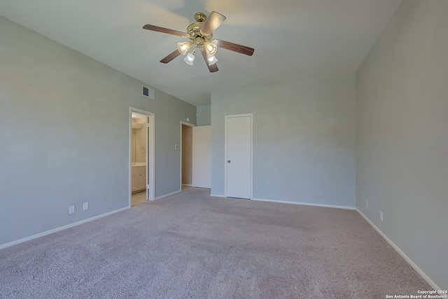 unfurnished bedroom with light carpet, ensuite bathroom, visible vents, and baseboards