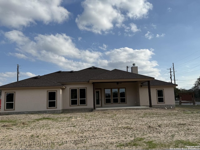 back of house featuring a patio area