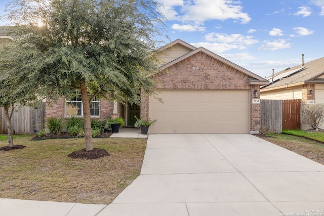 view of front of house featuring a front yard and a garage