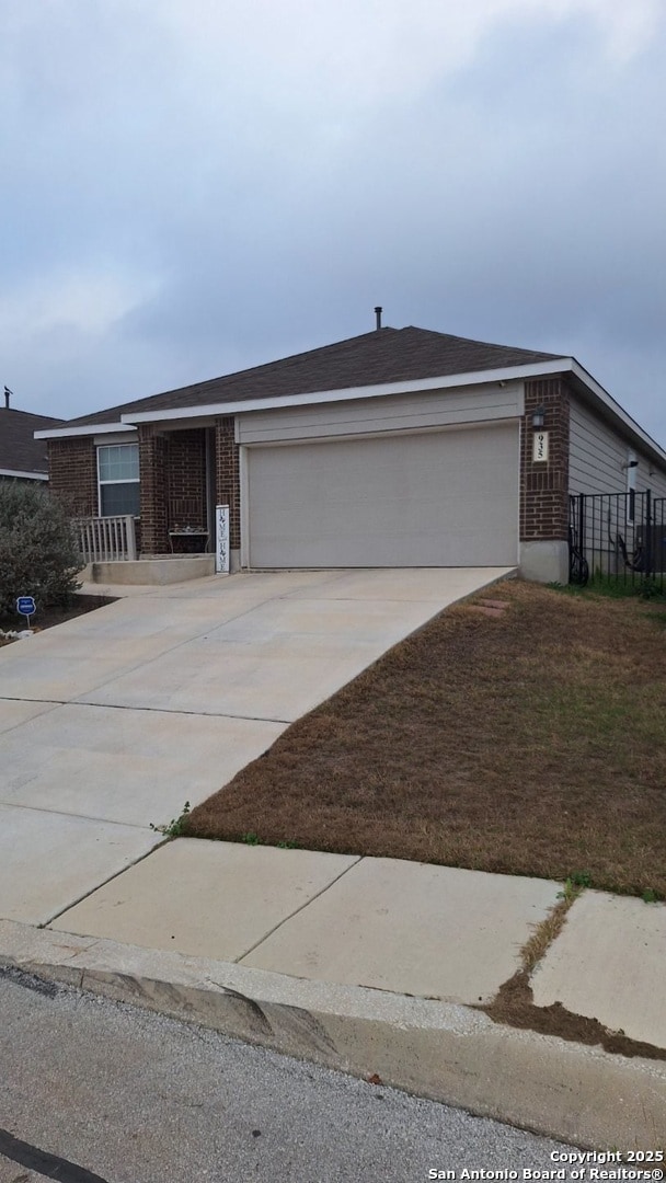 ranch-style home featuring a garage