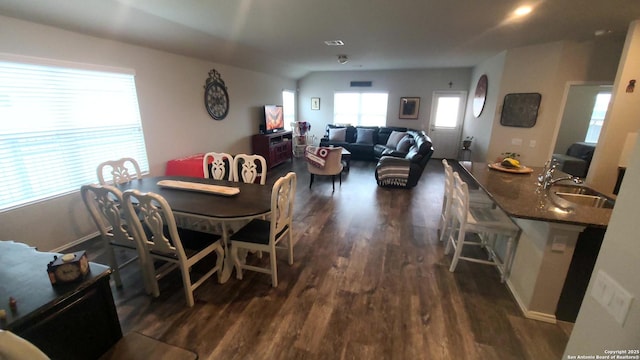 dining space with sink and dark hardwood / wood-style flooring