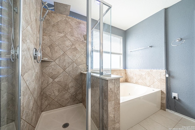 bathroom with shower with separate bathtub and tile patterned floors