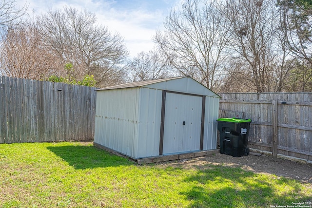 view of outbuilding with a lawn