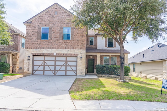 view of front of house with a front yard and a garage