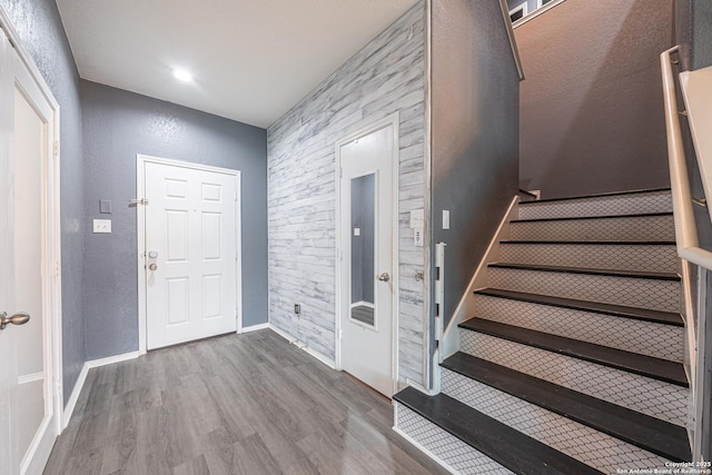 foyer entrance featuring wood-type flooring