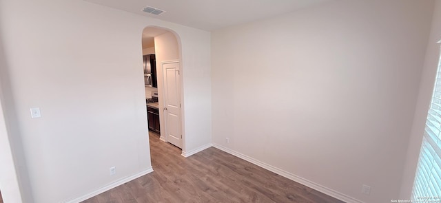 spare room featuring hardwood / wood-style flooring