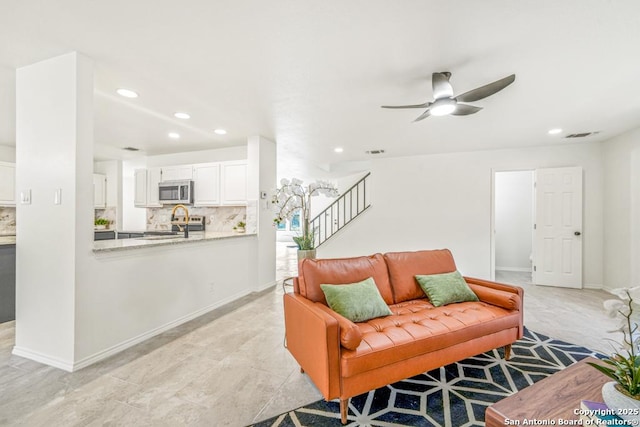 living room with ceiling fan