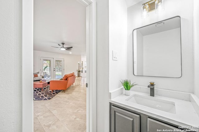 bathroom with ceiling fan and vanity