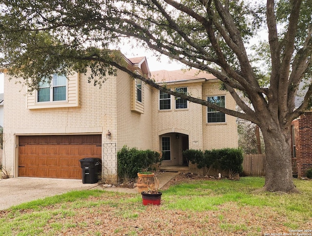 view of front facade featuring a front lawn and a garage