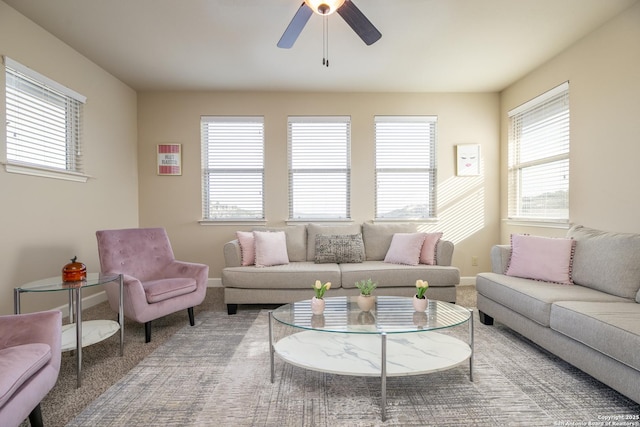 carpeted living room featuring ceiling fan