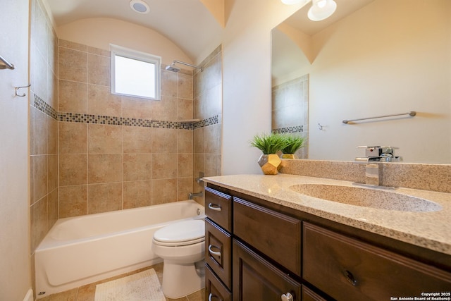 full bathroom featuring toilet, vanity, and tiled shower / bath