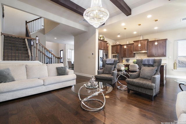 living room with an inviting chandelier, dark hardwood / wood-style flooring, and beam ceiling