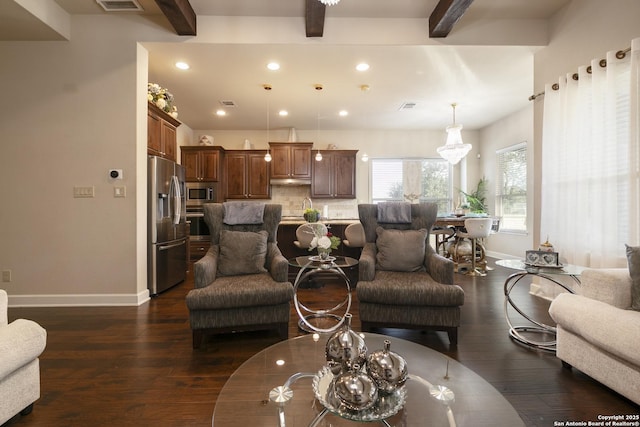 living room featuring dark hardwood / wood-style floors and beam ceiling