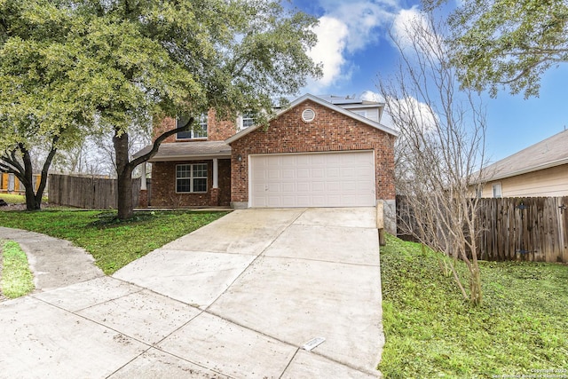 view of front property with a garage and a front yard