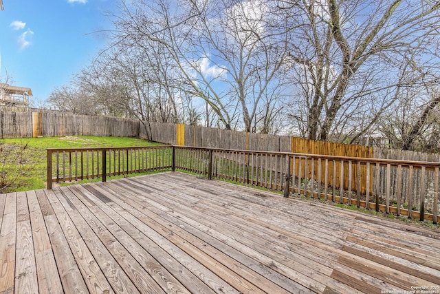 wooden deck with a lawn