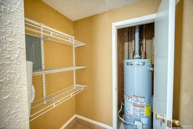 utility room with water heater