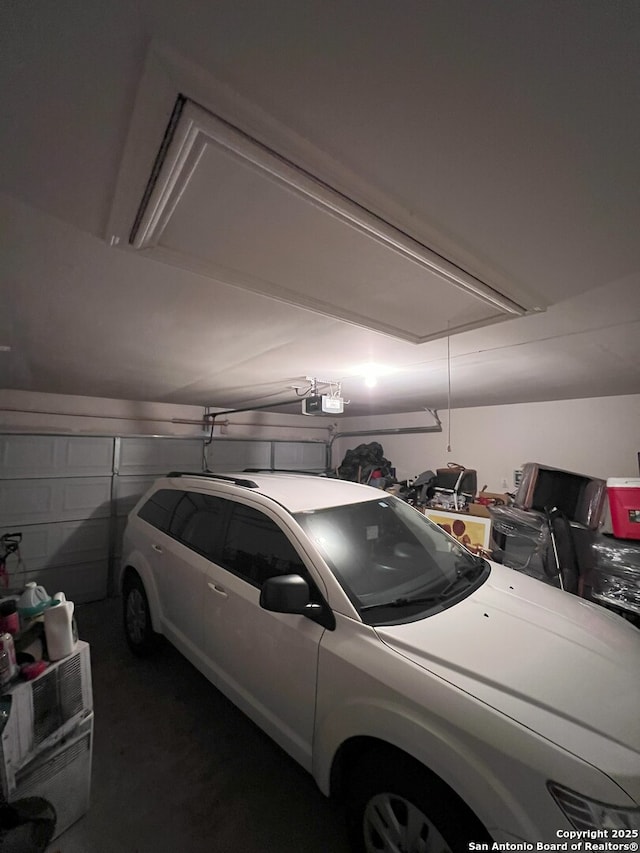 garage featuring a garage door opener