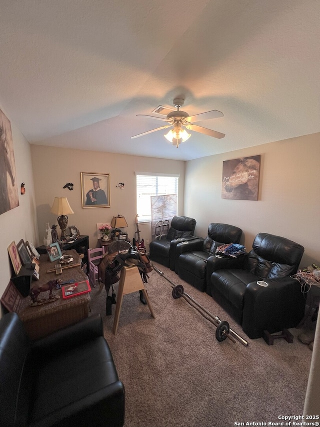 carpeted living room featuring ceiling fan